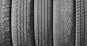 row of tires in various states of use