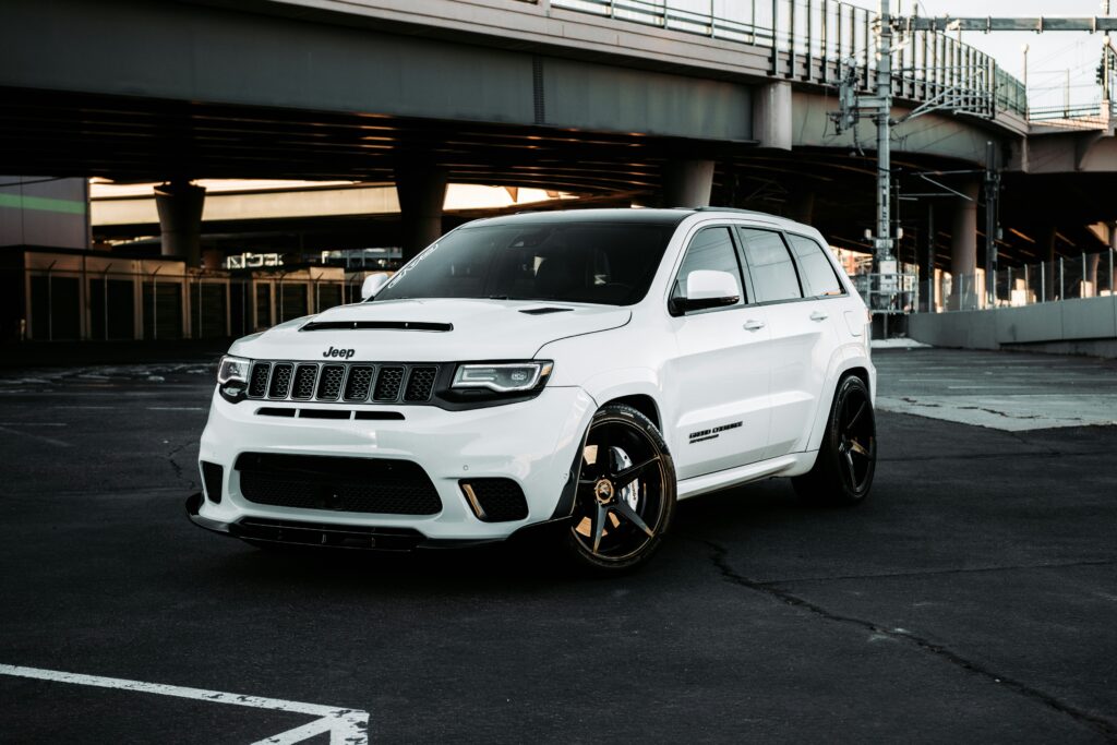 2024 white jeep grand cherokee parked